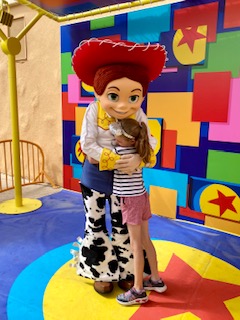 8 year old hugging Jessie from Toy Story
