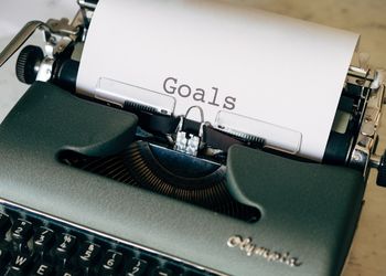 Typewriter with 'Goal' written on a sheet